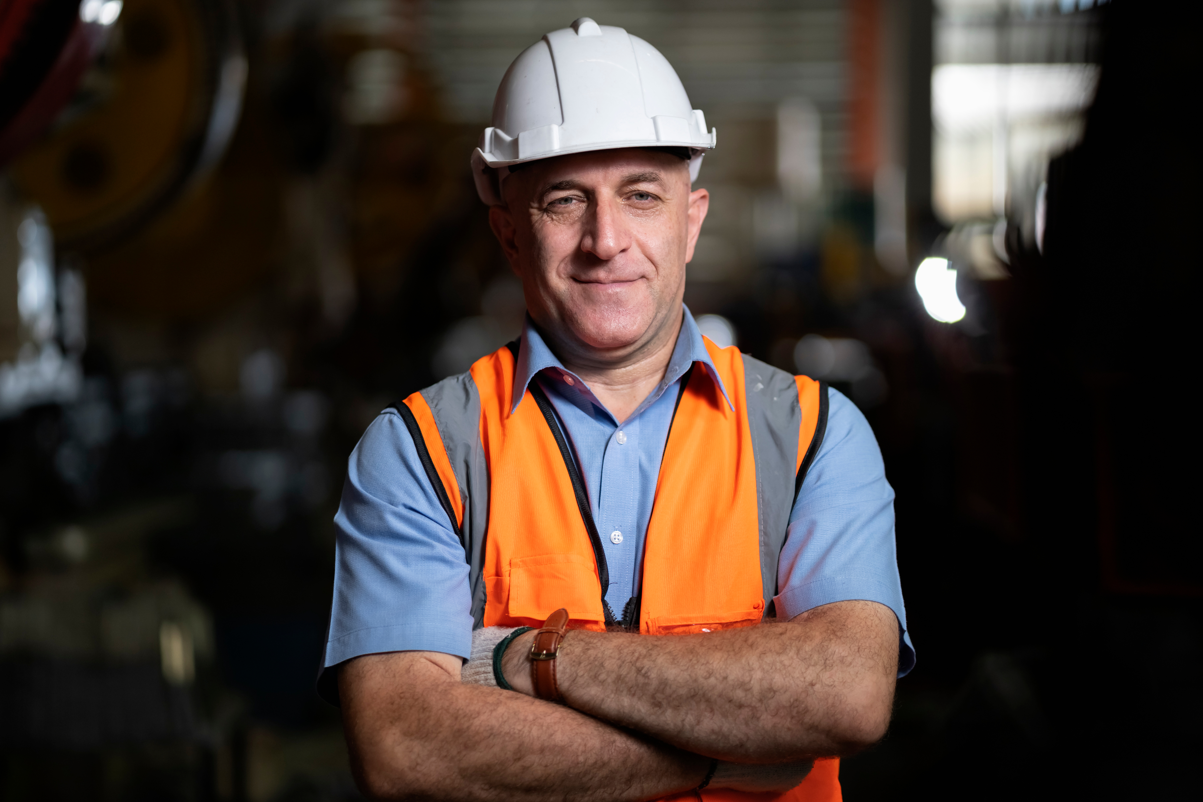 Manufacturing worker in hardhat and safety vest