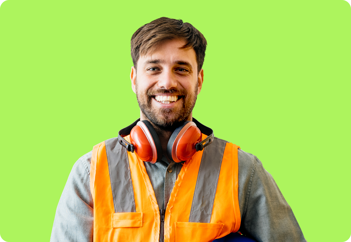 Manufacturing worker with safety headphones