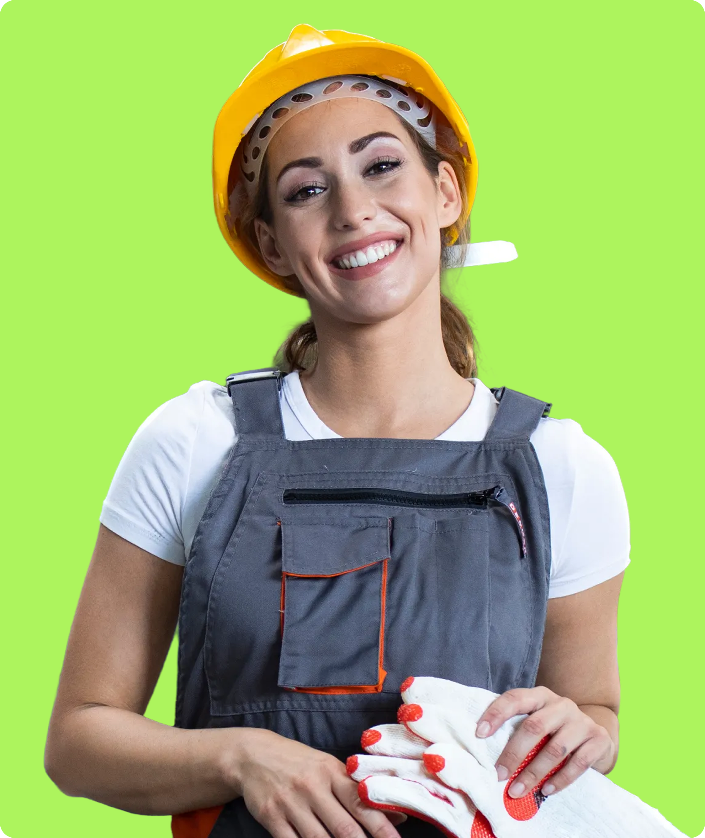 Manufacturing worker in hardhat holding gloves
